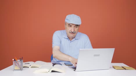 Old-man-working-hard-on-laptop.